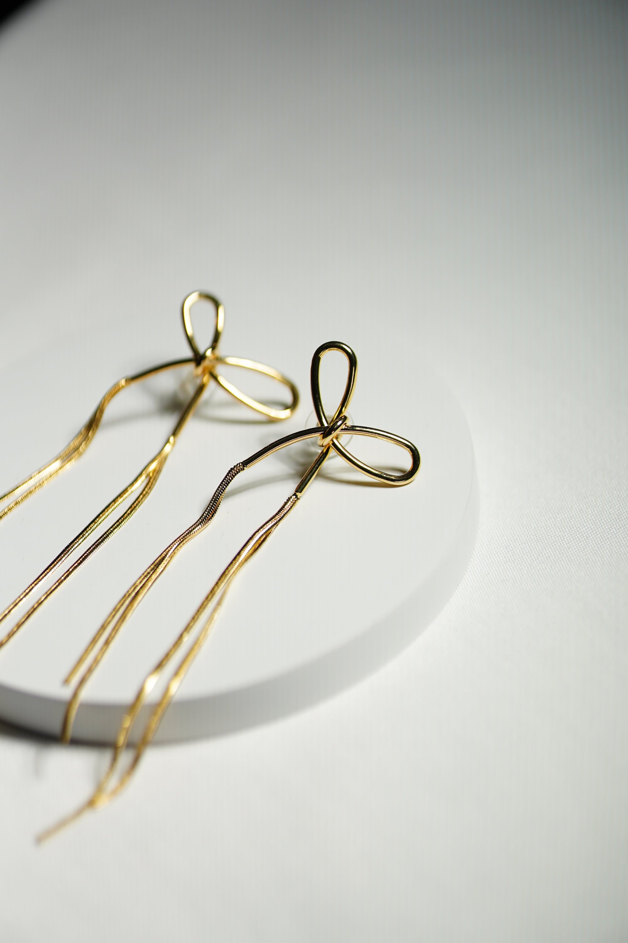 Charmella Bow. Earring.